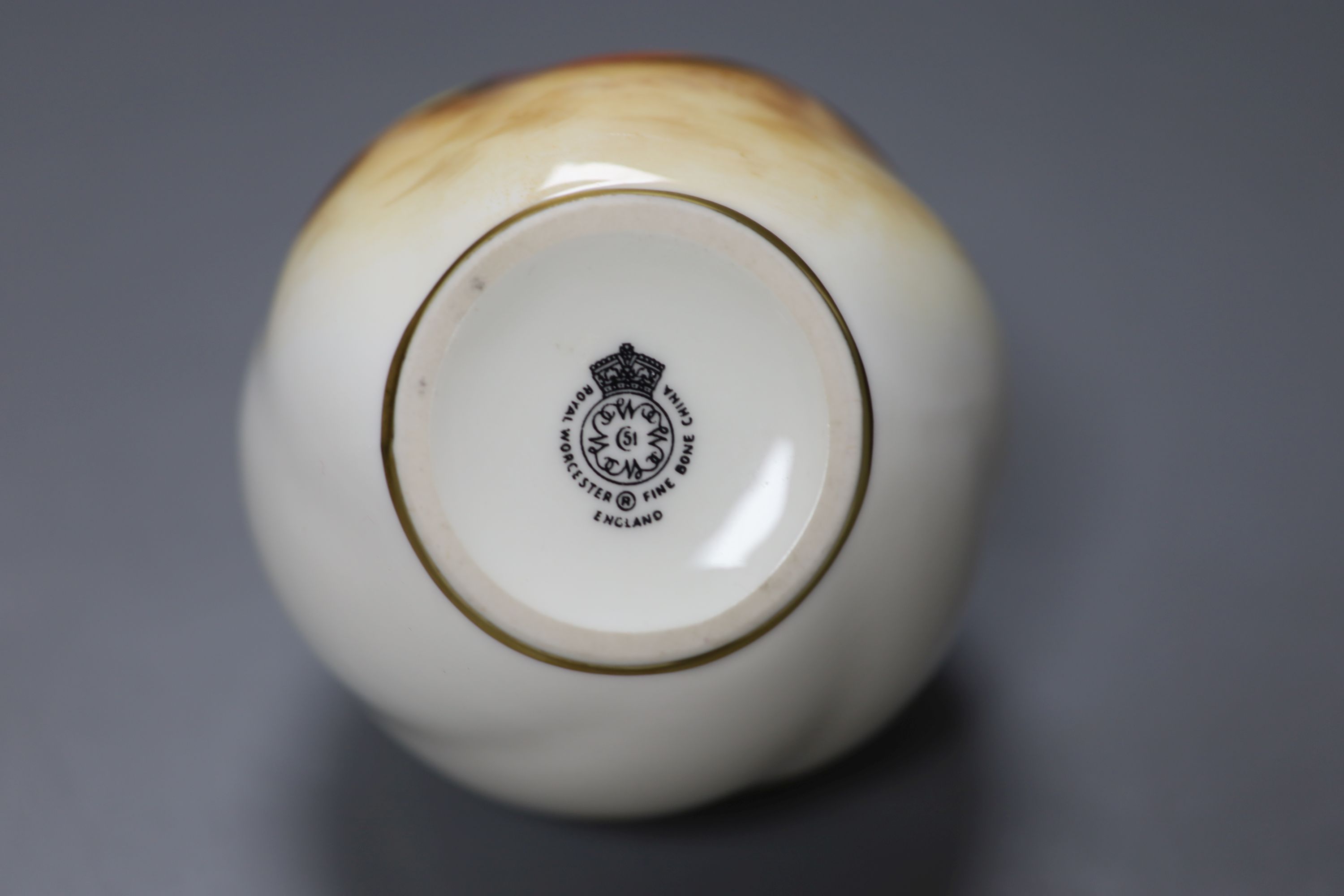 A Royal Worcester spirally globular vase painted with fruit by Roberts, signed, black mark, height 7cm